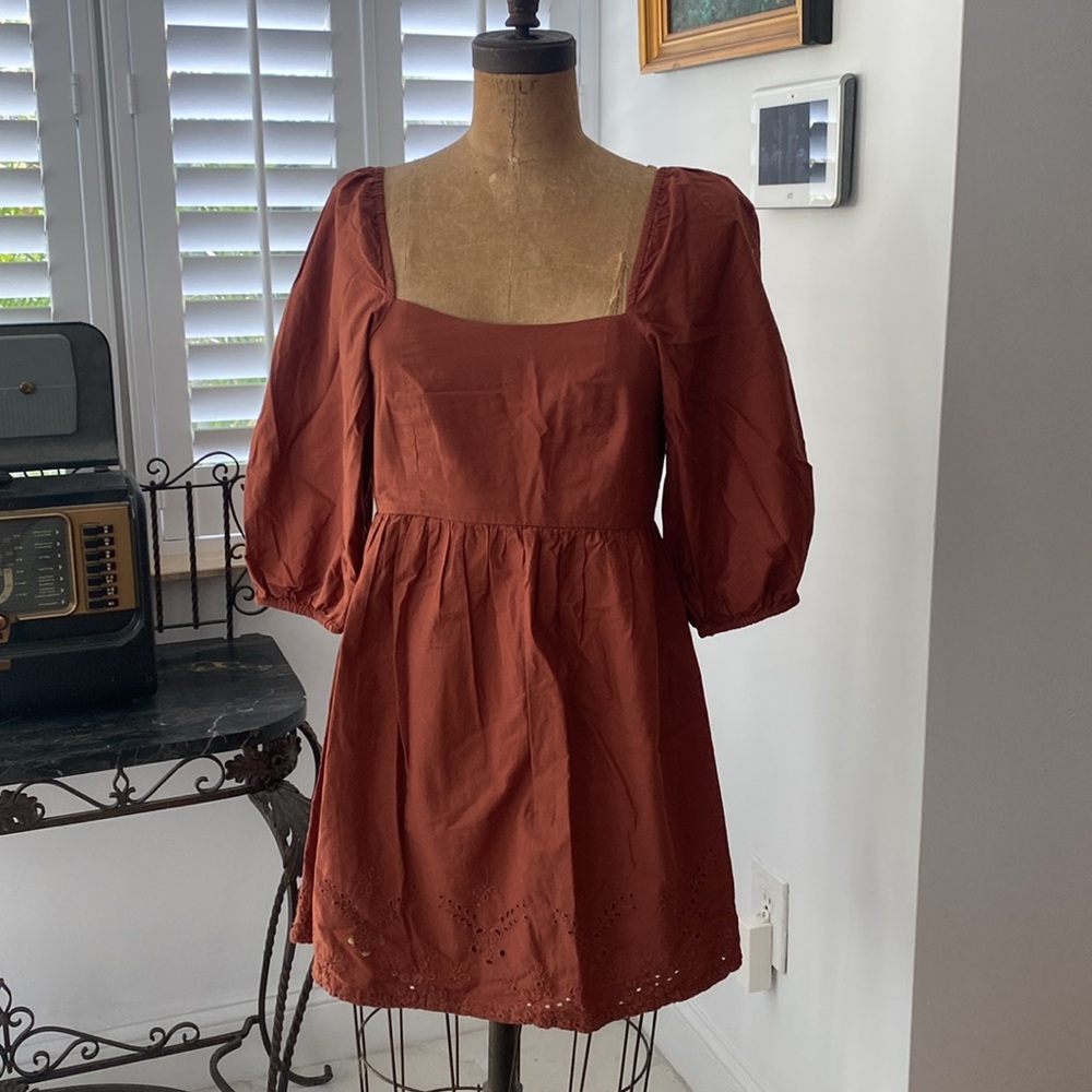 Empire cut brown dress.